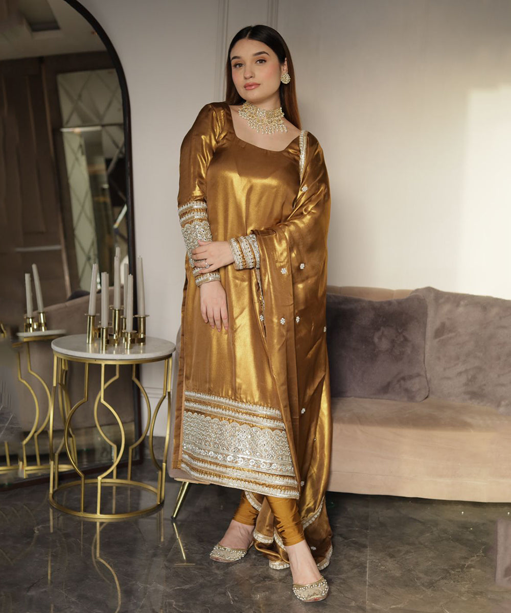 Shimmer georgette golden suit with Churidar Lycra leggings