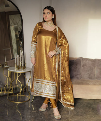 Shimmer georgette golden suit with Churidar Lycra leggings
